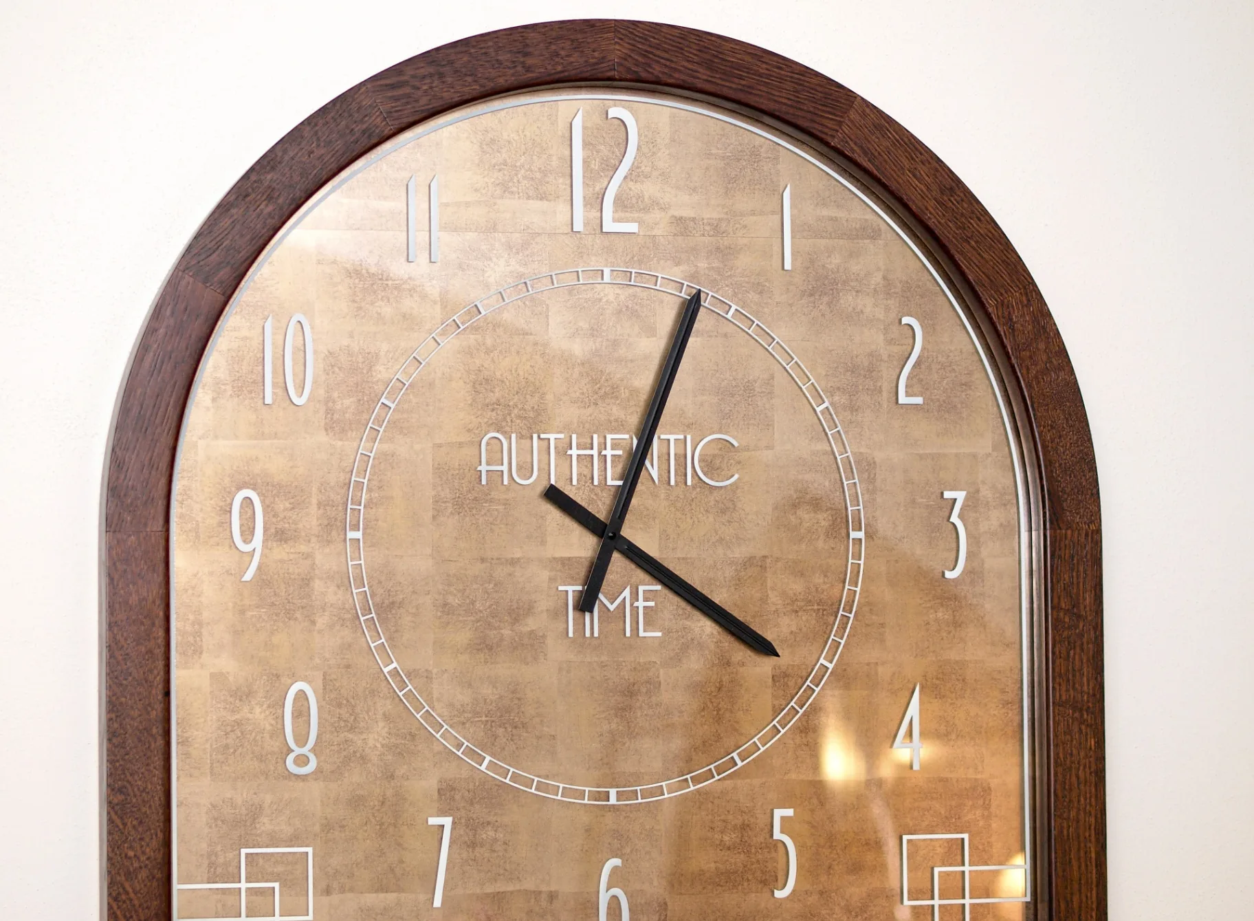 Detail of an art deco clock with the inscription Authentic Time